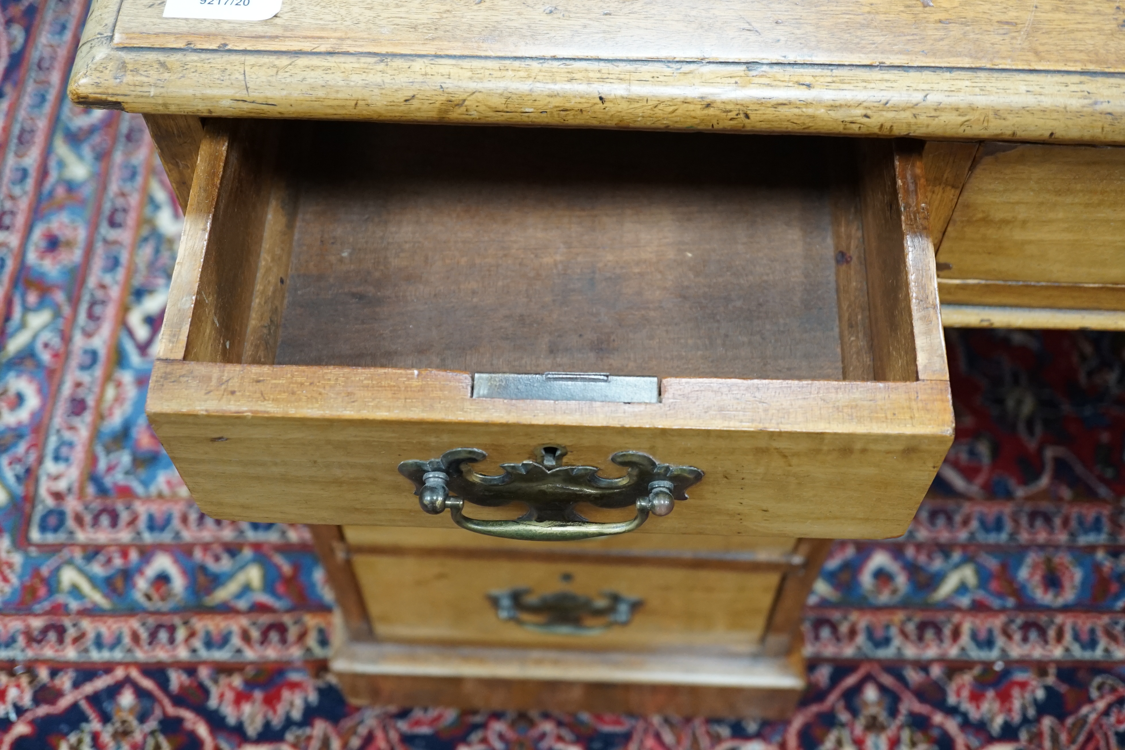 An Edwardian walnut leather-topped pedestal desk, width 120cm, height 72cm